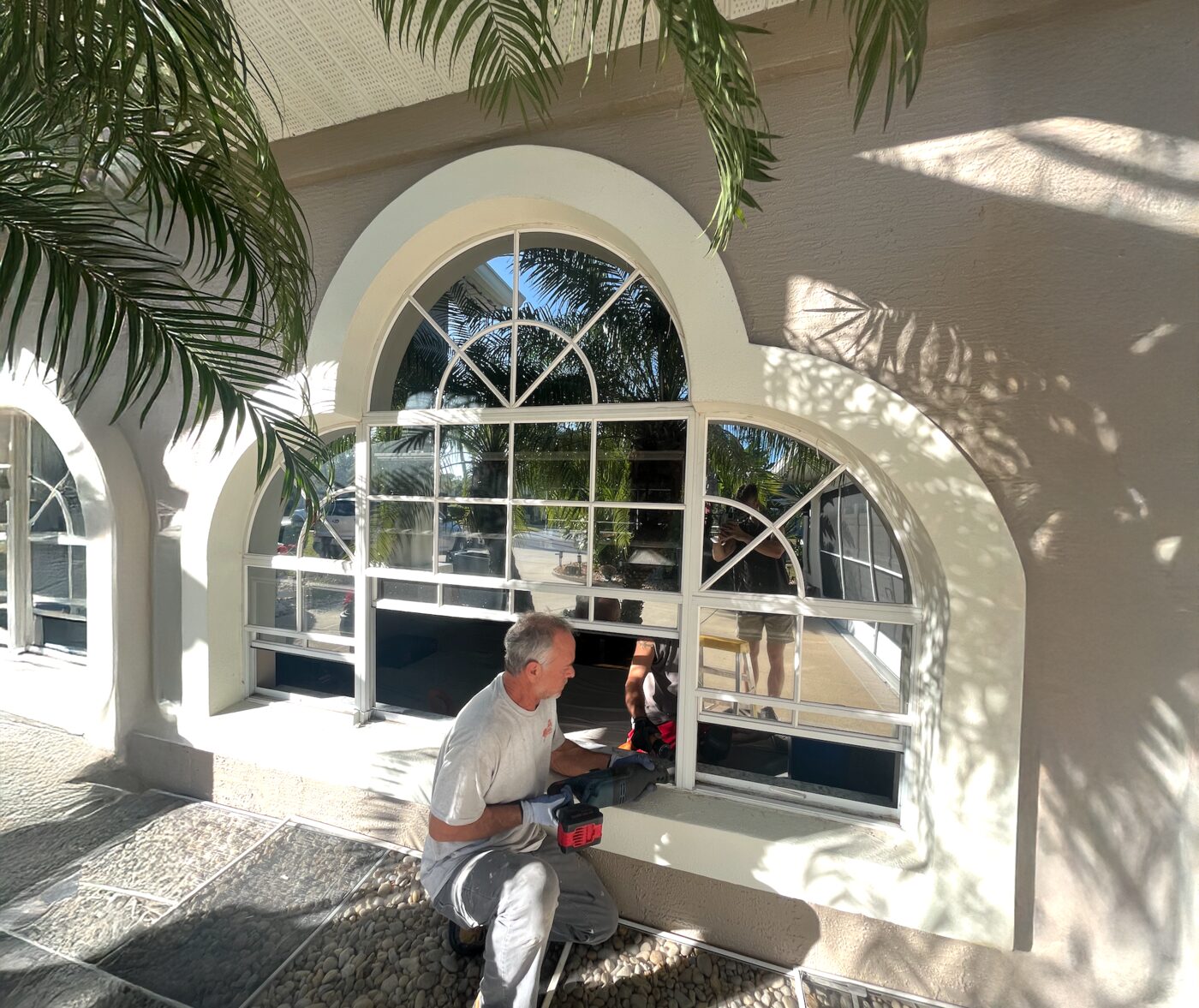 Arched window installation in progress