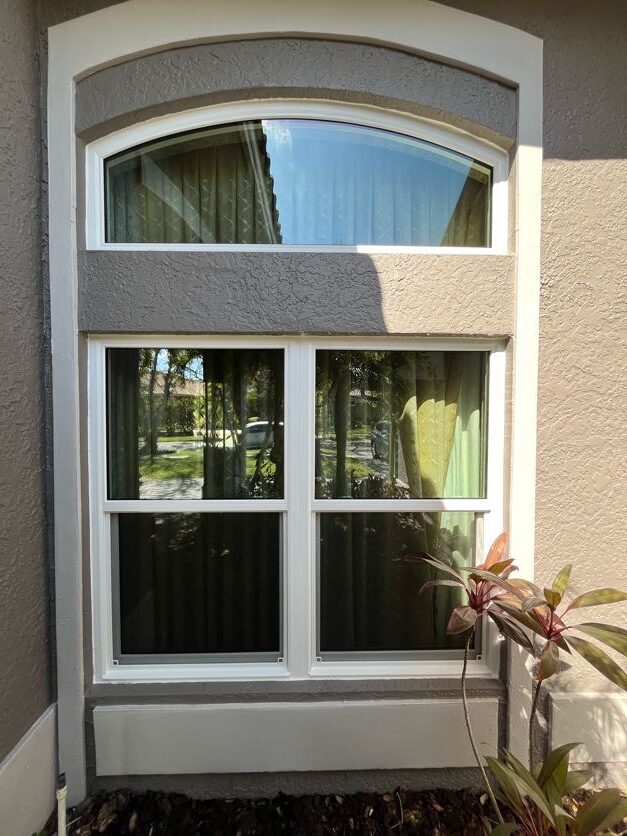 Arched transom impact window